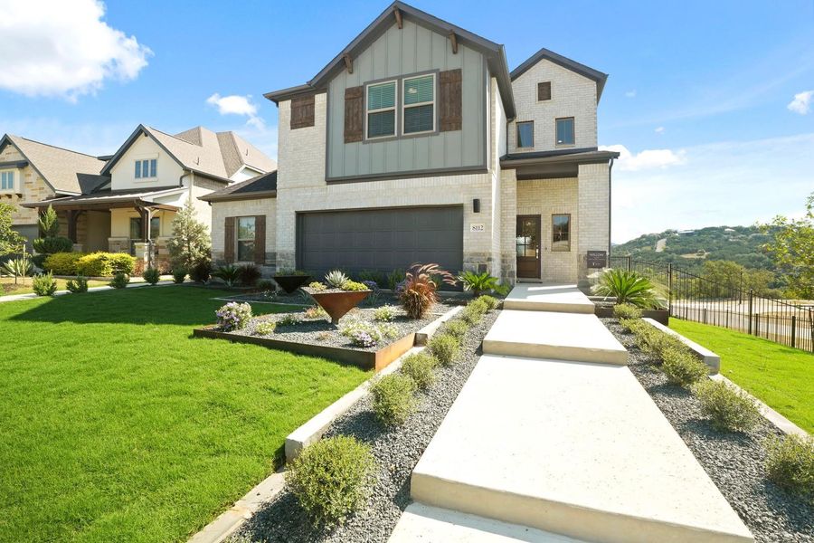 Front exterior of a new home in Lakeside at Tessera, Lago Vista, TX, highlighting curb appeal (Image 1). Front exterior of a new home in Lakeside at Tessera, Lago Vista, TX, highlighting curb appeal (Image 1).
