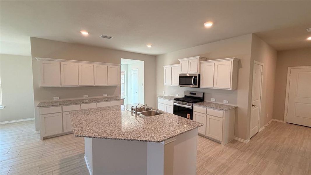 Kitchen-All Home and community information, including pricing, included features, terms, availability and amenities, are subject to change at any time without notice or obligation. All Drawings, pictures, photographs, video, square footages, floor plans, elevations, features, colors and sizes are approximate for illustration purposes only and will vary from the homes as built.
