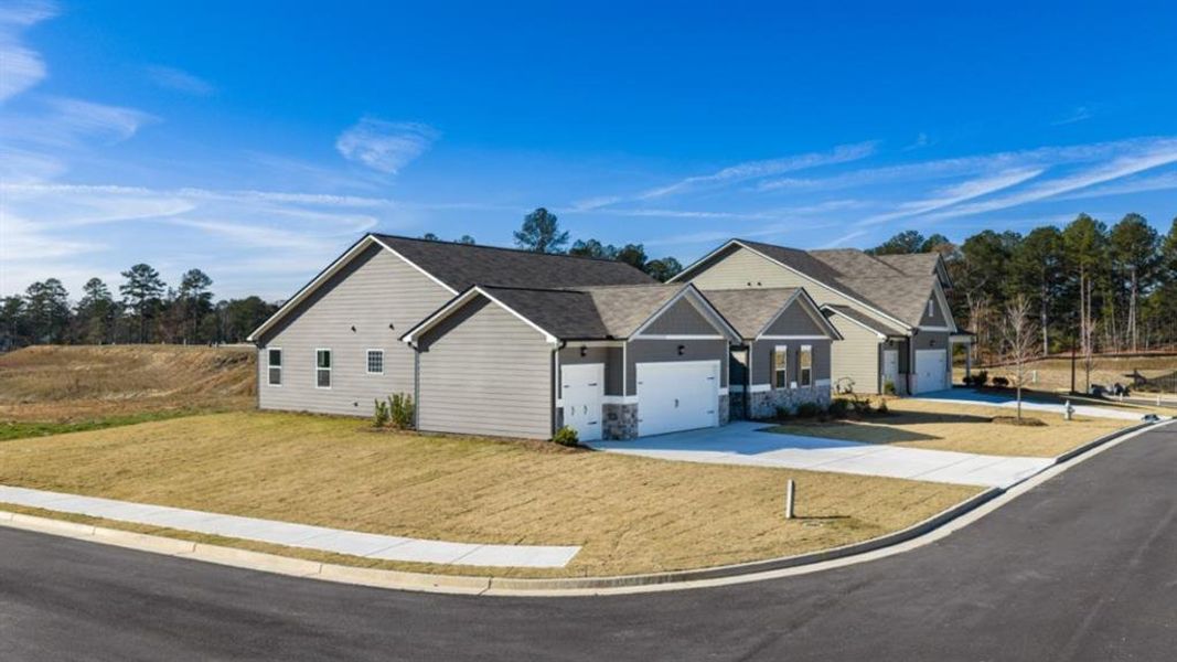 Front exterior of a new home in Fairway 17 at Mirror Lake, Villa Rica, GA, highlighting curb appeal (Image 21).
