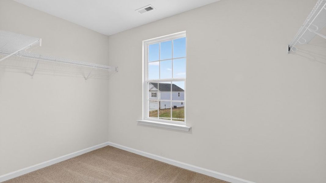 Spacious, unfurnished interior of a new home in Gretchen Pines, West End (Image 32).