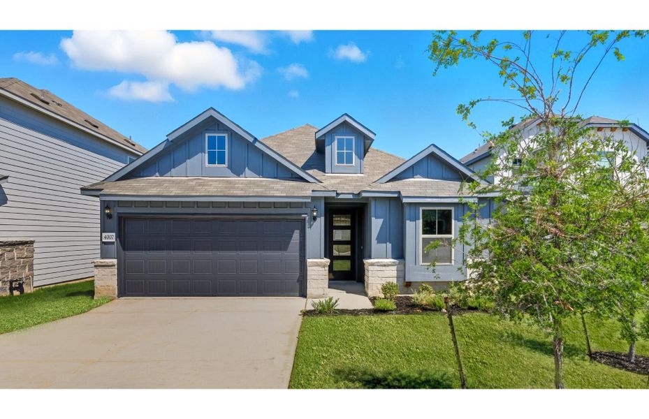 Front exterior of a new home in Lily Springs, Seguin, TX, highlighting curb appeal (Image 1). Front exterior of a new home in Lily Springs, Seguin, TX, highlighting curb appeal (Image 1).