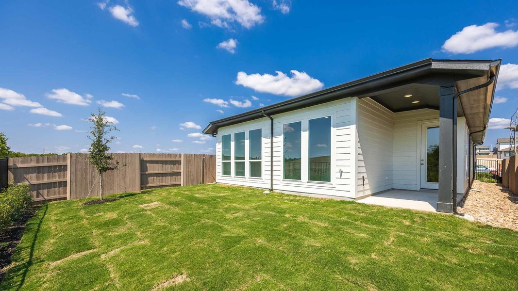 Back of property with a patio