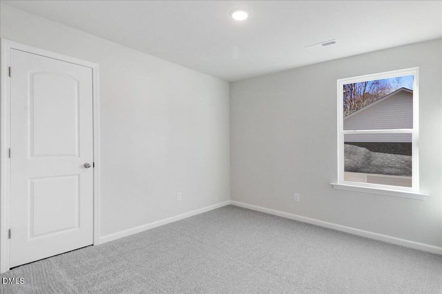 18-Secondary bedroom with window and neu