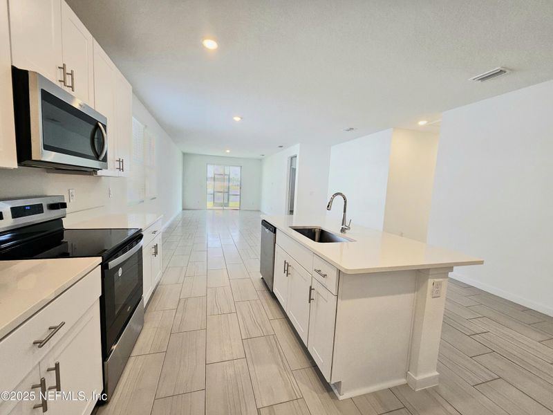 Furnished interior view inside a new home in Lakes at Bella Lago - Signature Series, Green Cove Springs (Image 14).