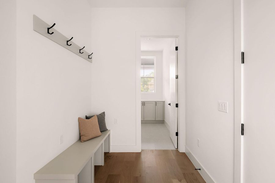 Mudroom with wood finished floors and baseboards Mudroom with wood finished floors and baseboards