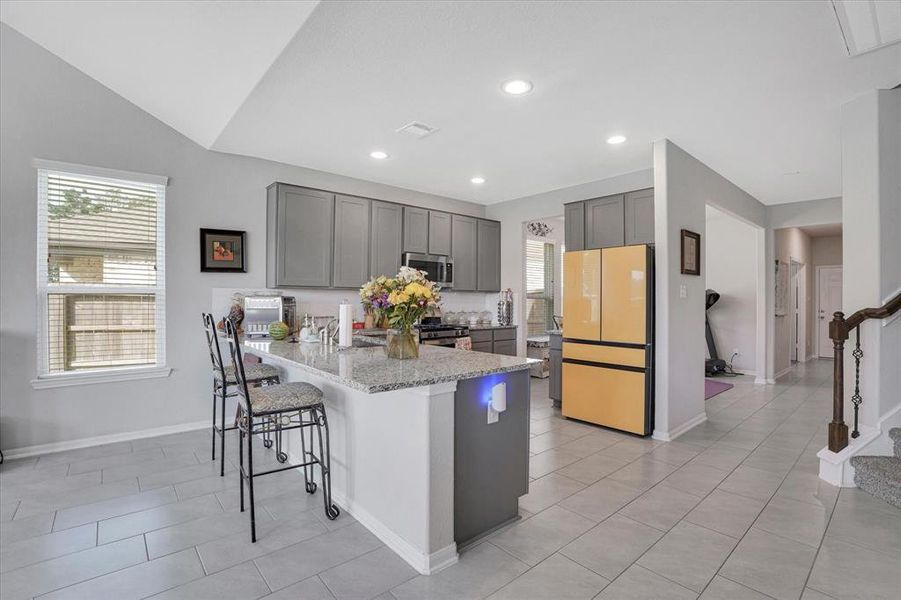 Seamless flow from the modern kitchen into the inviting family room.