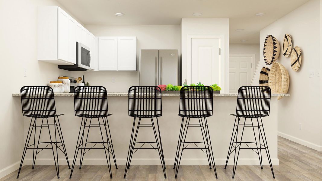 A kitchen with a table and chairs. A kitchen with a table and chairs.
