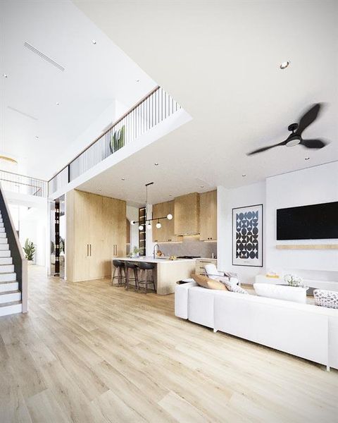 Living area with light wood-type flooring, stairway, and ceiling fan Living area with light wood-type flooring, stairway, and ceiling fan