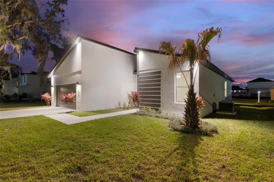 Front exterior of a new home in , Kissimmee, FL, highlighting curb appeal (Image 2).