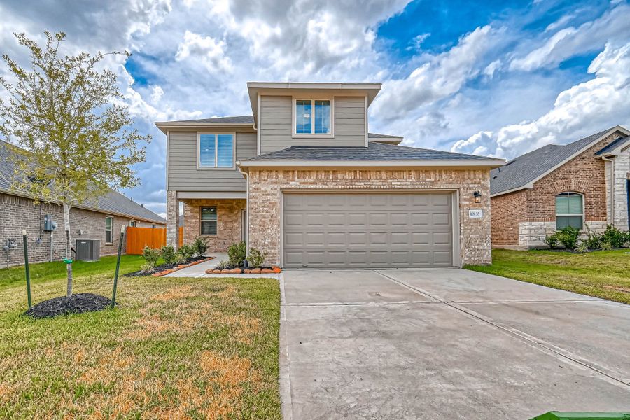 Representative exterior photo of a completed home built from the Floor Plan 2340 by Colina Homes in Grand Magnolia, Magnolia, TX (Image 22). Representative exterior photo of a completed home built from the Floor Plan 2340 by Colina Homes in Grand Magnolia, Magnolia, TX (Image 22).