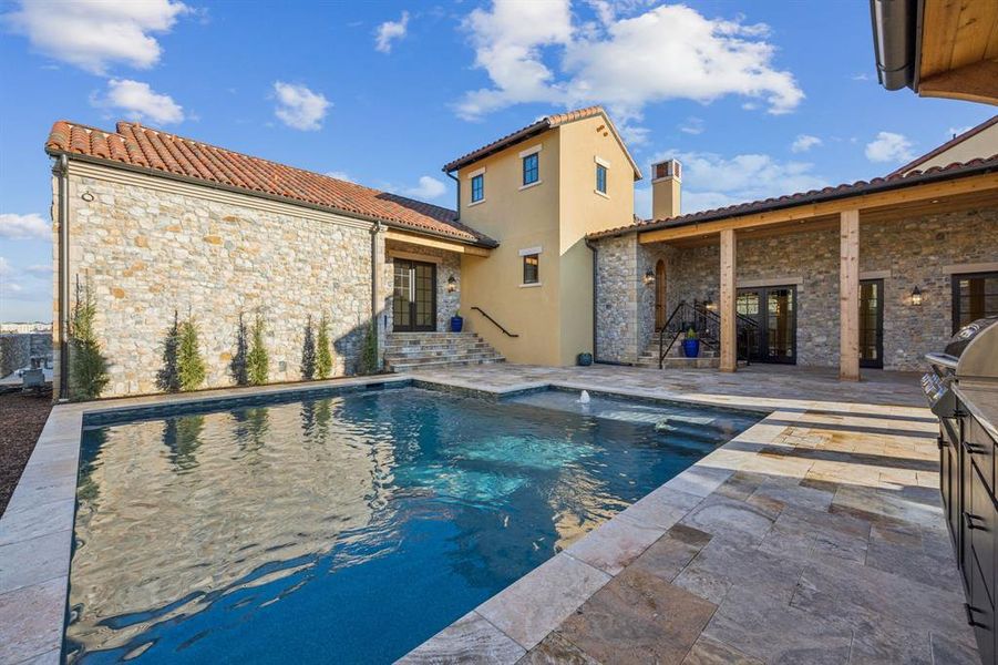 Swimming pool featuring a patio, grilling area, and french doors