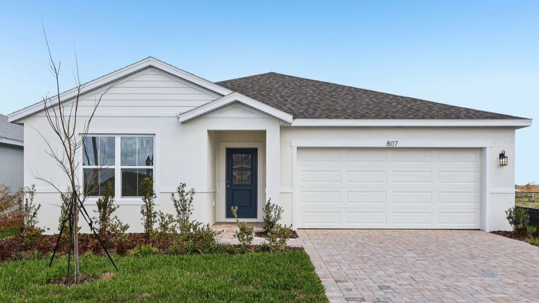 Representative exterior photo of a completed home built from the Baker by DRB Homes in Hamilton Bluff, Haines City, FL (Image 23).