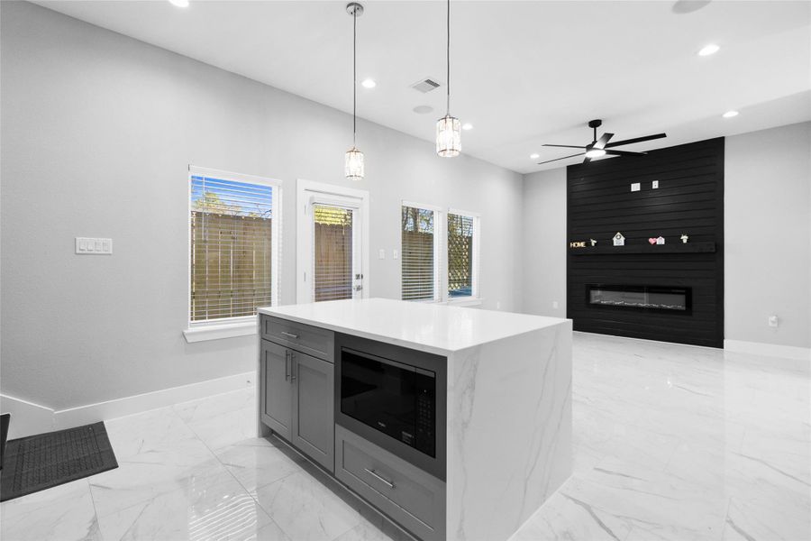 Standing at the island, you appreciate how the open view connects your kitchen to the living space, so you never miss a moment of the conversation.