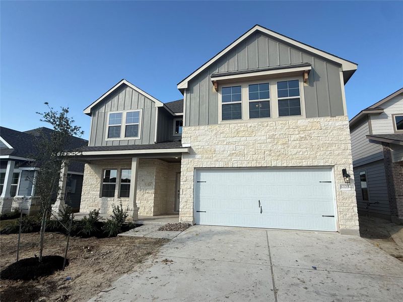 Front exterior of a new home in Southern Pointe, College Station, TX, highlighting curb appeal (Image 1).