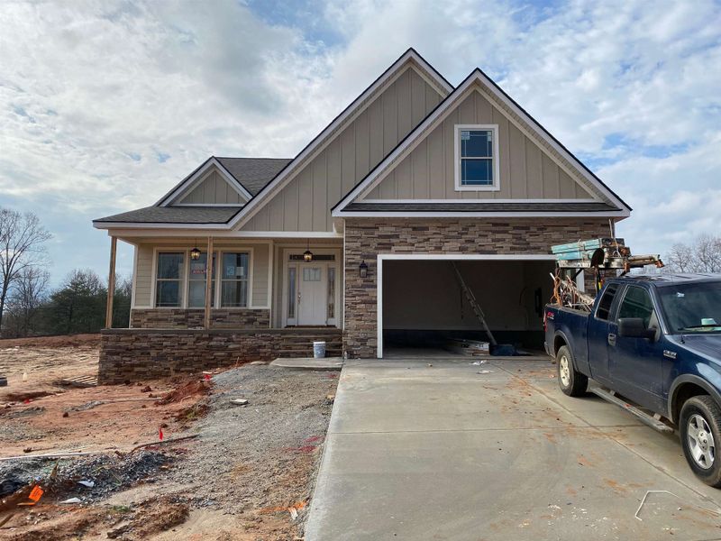Front exterior of a new home in Tubbs Mountain Estates, Travelers Rest, SC, highlighting curb appeal (Image 1). Front exterior of a new home in Tubbs Mountain Estates, Travelers Rest, SC, highlighting curb appeal (Image 1).