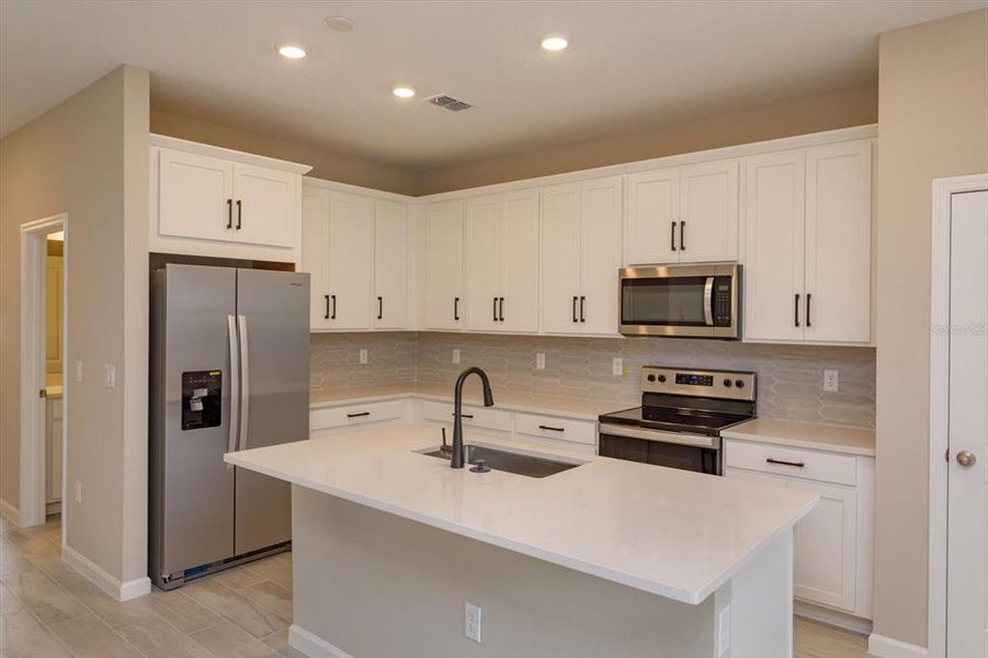Furnished interior view inside a new home in Serenade at Ovation, Winter Garden (Image 13).