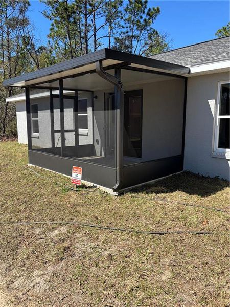 Exterior details and patio area of a home in , Citrus Springs (Image 32).