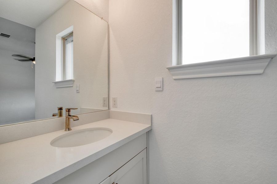 The separate vanity gives each bedroom its own place to get ready without competing for counter space.