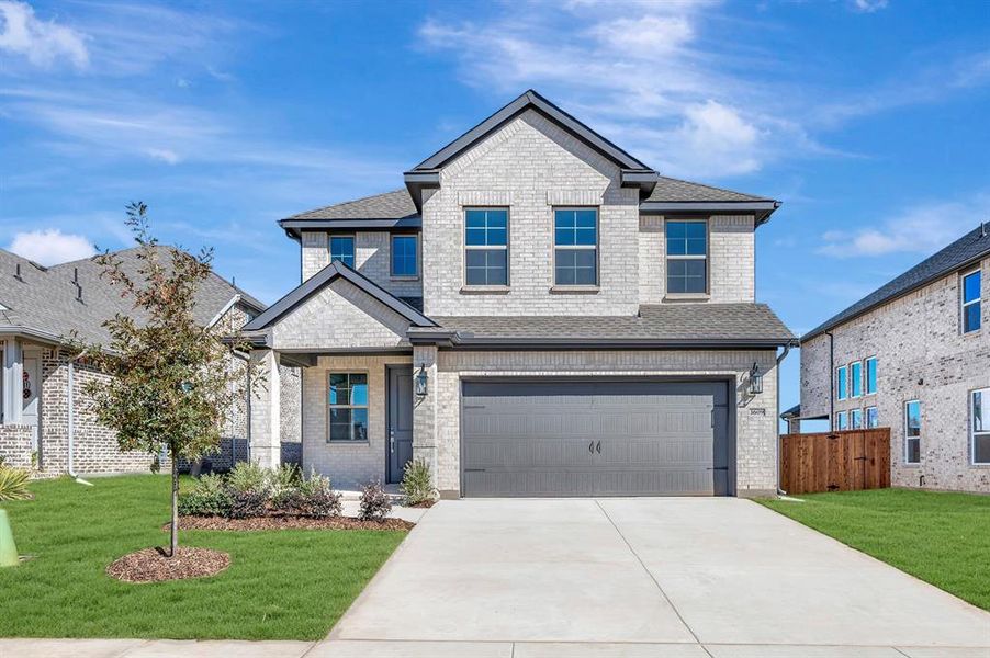 Front exterior of a new home in Heritage Ranch, Sherman, TX, highlighting curb appeal (Image 1). Front exterior of a new home in Heritage Ranch, Sherman, TX, highlighting curb appeal (Image 1).