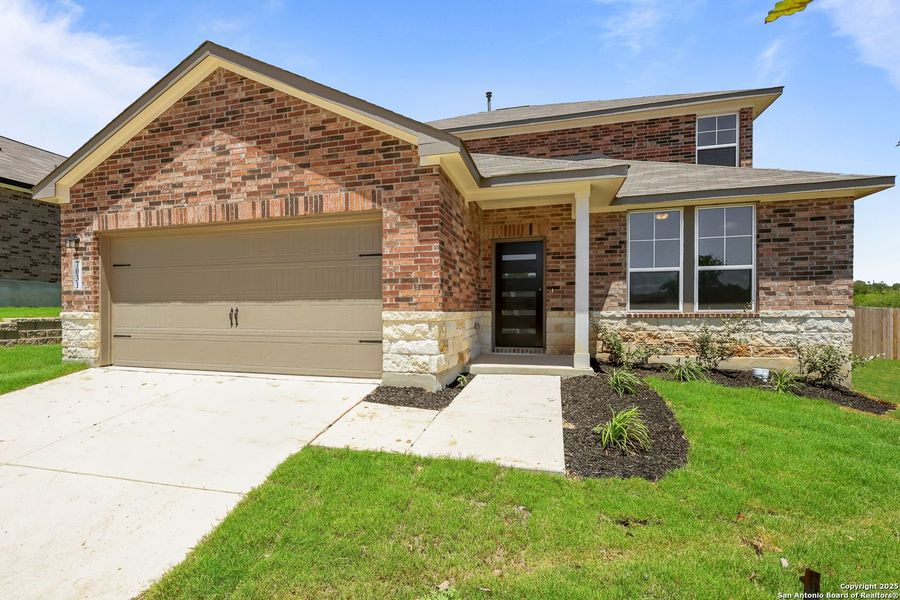 Front exterior of a new home in Comanche Ridge, San Antonio, TX, highlighting curb appeal (Image 21). Front exterior of a new home in Comanche Ridge, San Antonio, TX, highlighting curb appeal (Image 21).