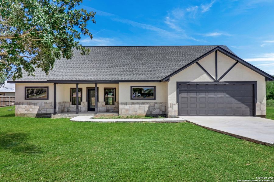 Front exterior of a new home in , Lytle, TX, highlighting curb appeal (Image 24). Front exterior of a new home in , Lytle, TX, highlighting curb appeal (Image 24).