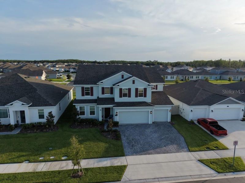 Front exterior of a new home in , Kissimmee, FL, highlighting curb appeal (Image 22).