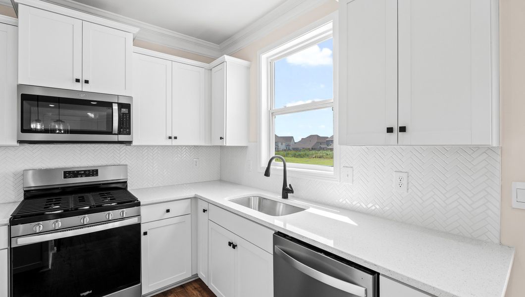 Representative furnished interior of a home built from the VERWOOD by D.R. Horton in Adams Glen, Greenville (Image 9).