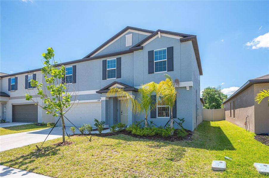 Front exterior of a new home in , Plant City, FL, highlighting curb appeal (Image 21).