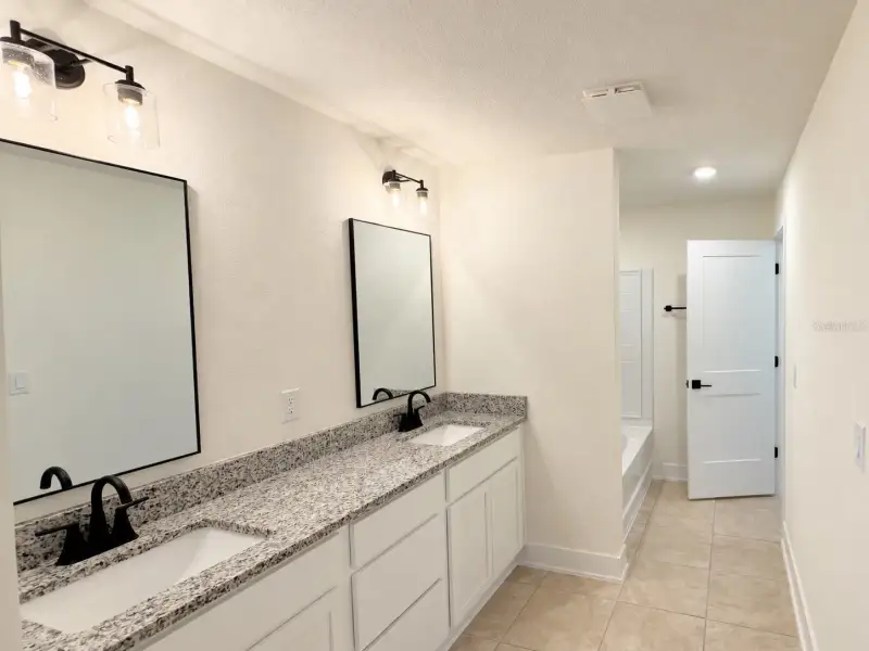 Furnished interior view inside a new home in Harmony Central, St. Cloud (Image 8).