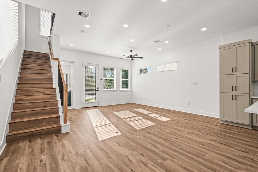 Sprawling layout, infinite possibilities. This commanding viewpoint shows how the entire main floor harmonizes, effortlessly connecting the entrance, storage hubs, and upper levels.