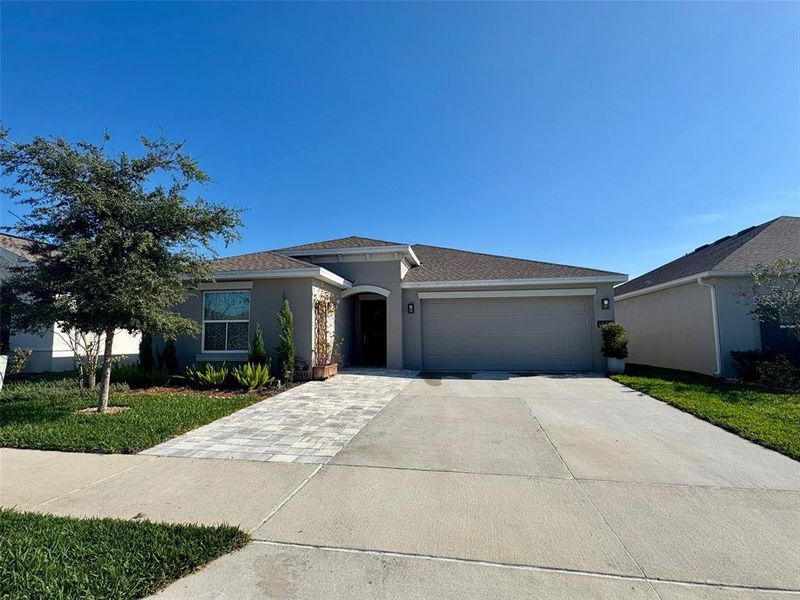 Front exterior of a new home in , Groveland, FL, highlighting curb appeal (Image 2). Front exterior of a new home in , Groveland, FL, highlighting curb appeal (Image 2).