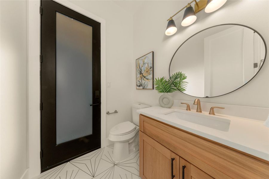 Bathroom featuring vanity and light tile patterned floors
