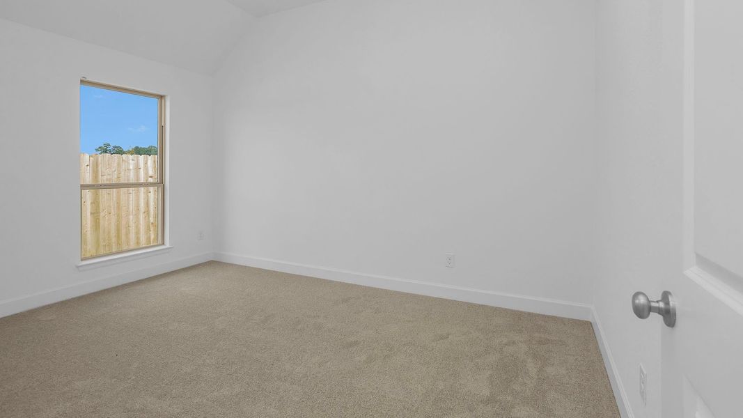 Spacious, unfurnished interior of a new home in Artavia 50', Conroe (Image 8).