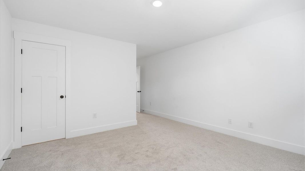 First-rate secondary bedroom with a spacious walk-in closet and elegant carpeted flooring at Silo Ridge First-rate secondary bedroom with a spacious walk-in closet and elegant carpeted flooring at Silo Ridge