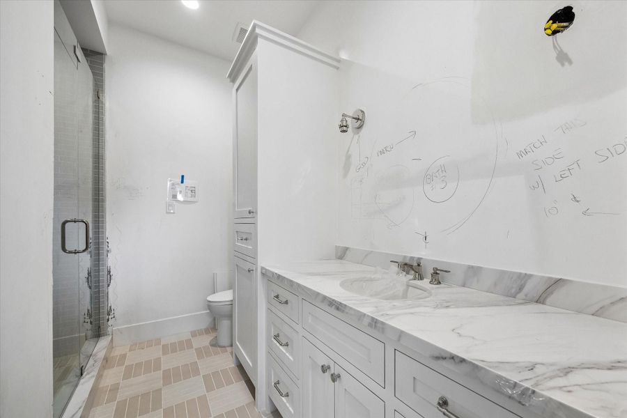 One of the four secondary bathrooms. Pictured April 2026.