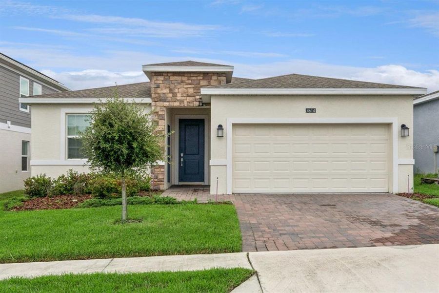 Front exterior of a new home in , Davenport, FL, highlighting curb appeal (Image 1). Front exterior of a new home in , Davenport, FL, highlighting curb appeal (Image 1).