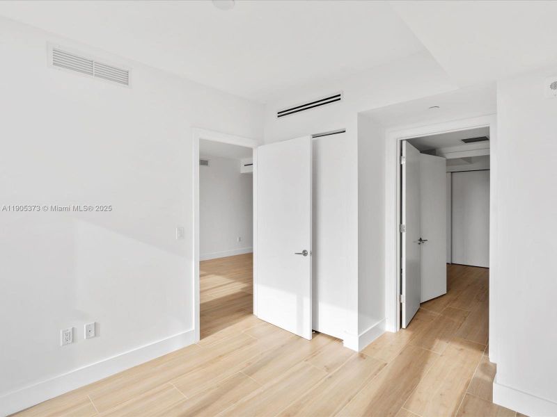 Second Bedroom with reach-in closet and linen closet