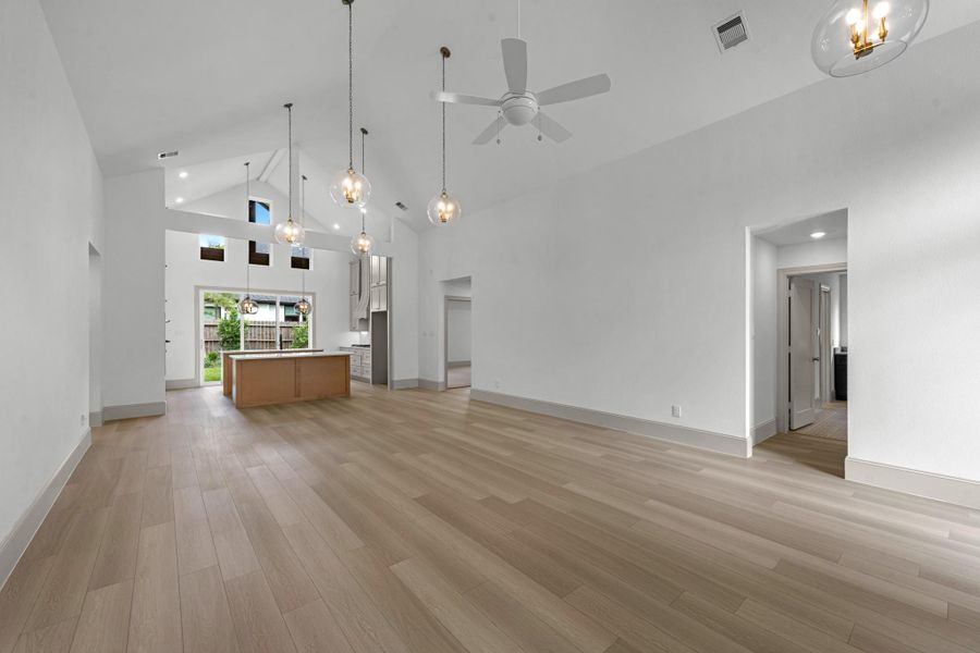 Open concept showing the formal dining area and view to the kitchen with stunning architecture. Open concept showing the formal dining area and view to the kitchen with stunning architecture.