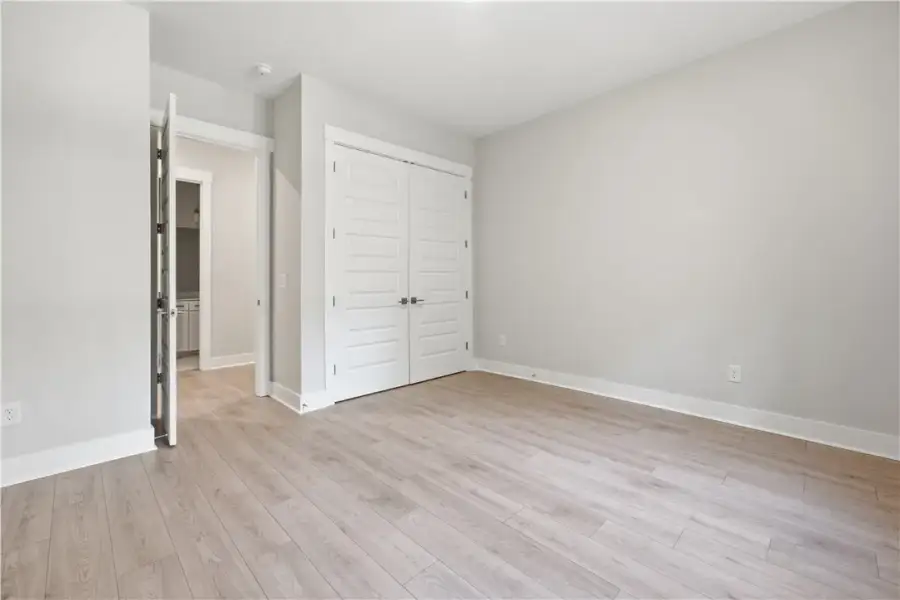 Smooth wood flooring and clean lines define this v