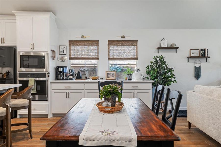 Dining space with wood finished floors Dining space with wood finished floors