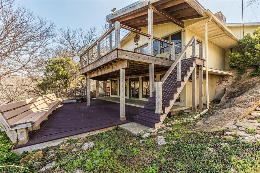 Rear faces toward lake. Lower level bonus room, opens to trex decking. Stairs lead up to trex deck into Great room Rear faces toward lake. Lower level bonus room, opens to trex decking. Stairs lead up to trex deck into Great room