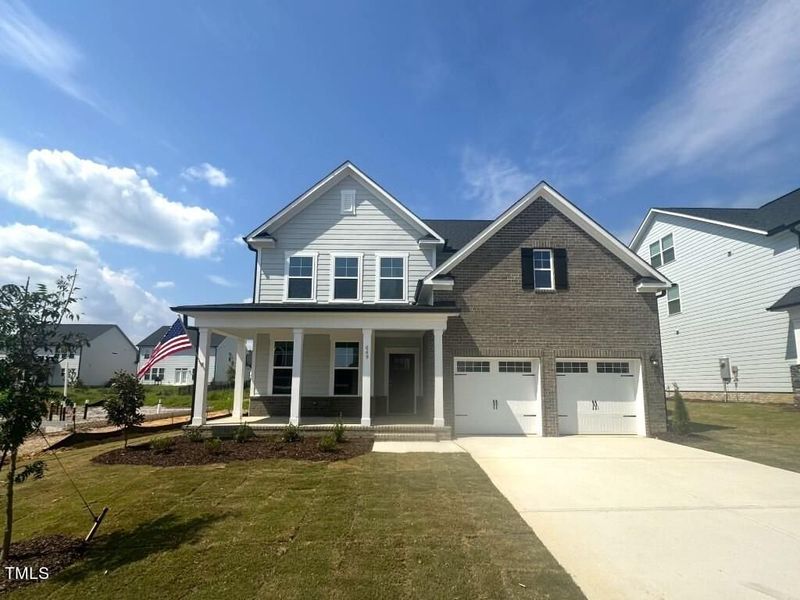 Front exterior of a new home in Glenmere, Knightdale, NC, highlighting curb appeal (Image 115). Front exterior of a new home in Glenmere, Knightdale, NC, highlighting curb appeal (Image 115).