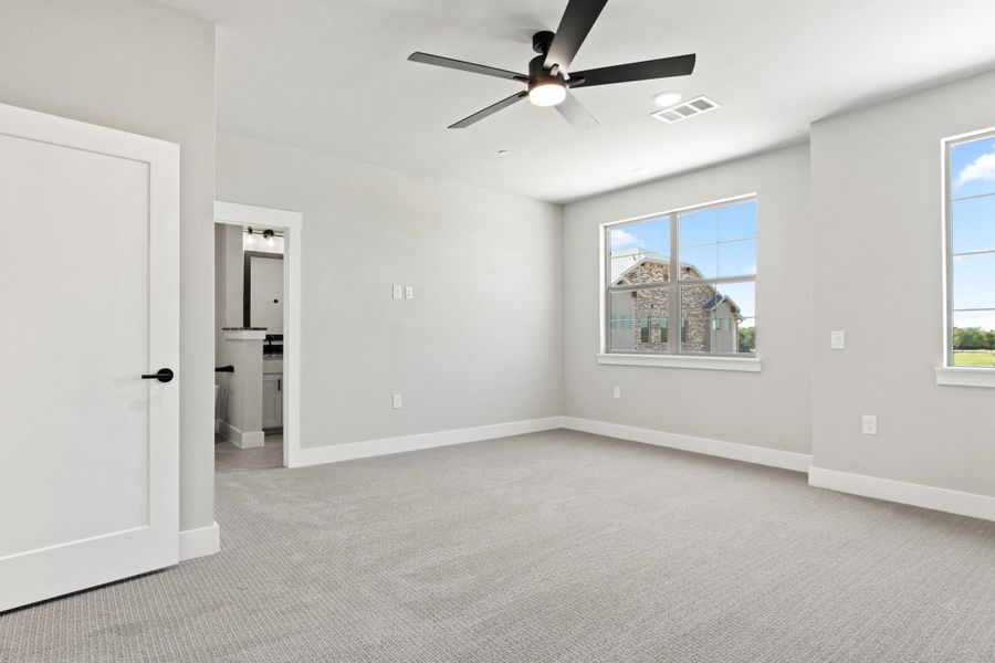 Spacious, unfurnished interior of a new home in The Tribute, The Colony (Image 34).