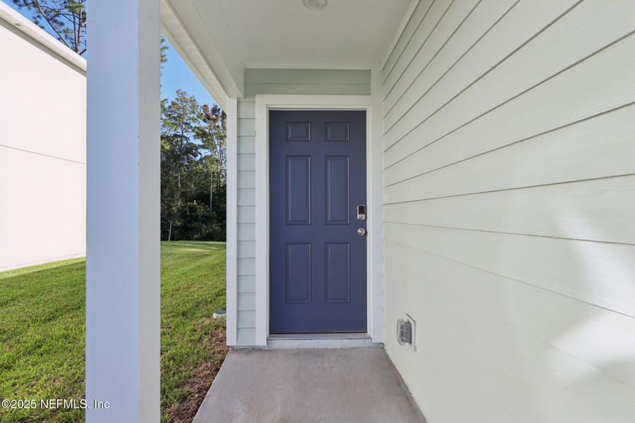 Exterior details and patio area of a home in Flagler Village - Classic Series, Palm Coast (Image 3).