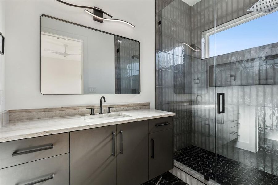 Bathroom with vanity and an enclosed shower