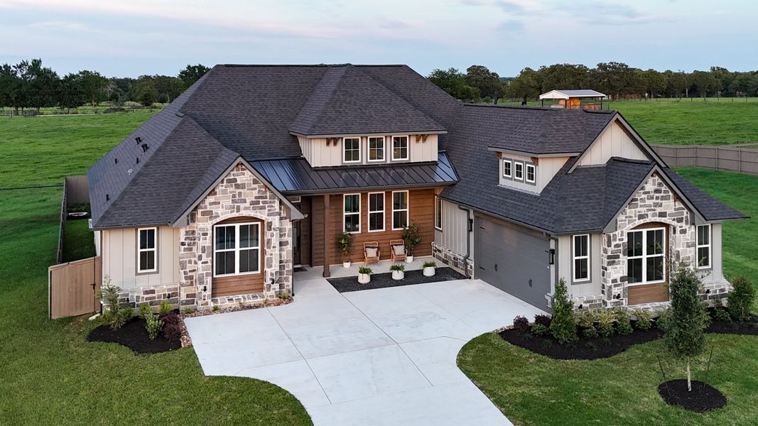 Front exterior of a new home in Stella Ranch, Bryan, TX, highlighting curb appeal (Image 29).
