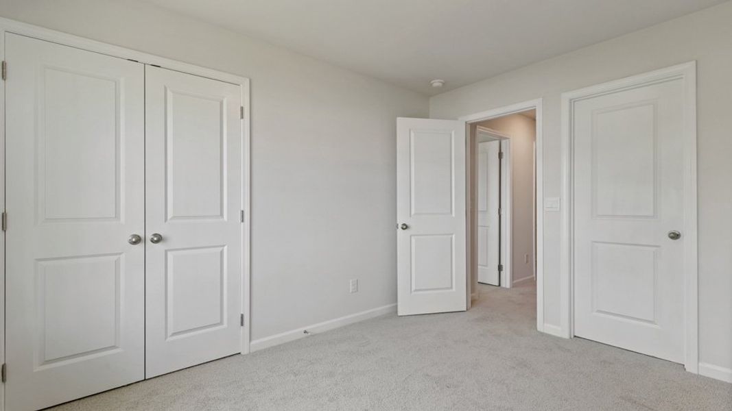 Representative unfurnished interior of a home built from the LANSING - TRADITIONS by D.R. Horton in Chapel Townes, Raleigh (Image 27).