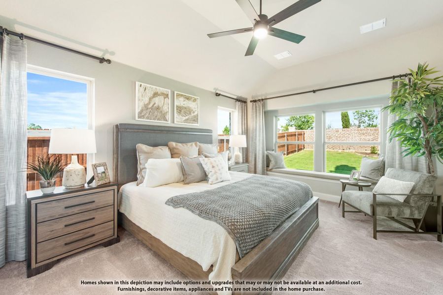 Bedroom with king bed, vaulted ceiling, ceiling fan, window seat, and multiple windows with backyard views. Bedroom with king bed, vaulted ceiling, ceiling fan, window seat, and multiple windows with backyard views.