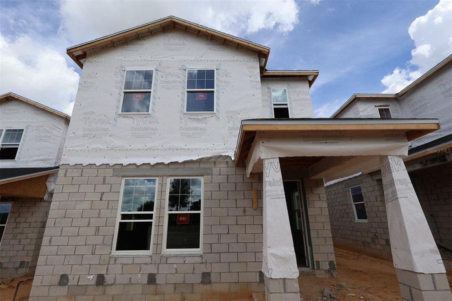 Exterior details and patio area of a home in Lake Star at Ovation, Winter Garden (Image 2).
