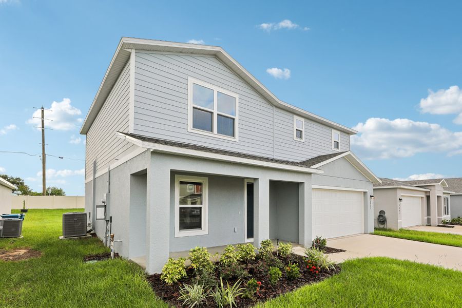 A white house with a driveway. A white house with a driveway.